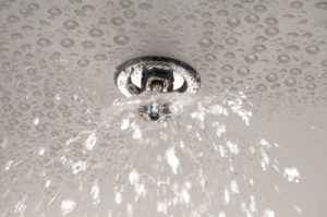 Fire sprinkler system spraying water